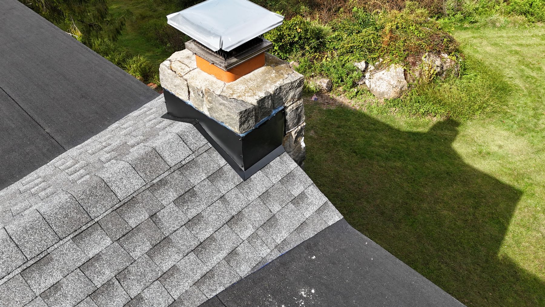 New ridge shingles and chimney cap from above